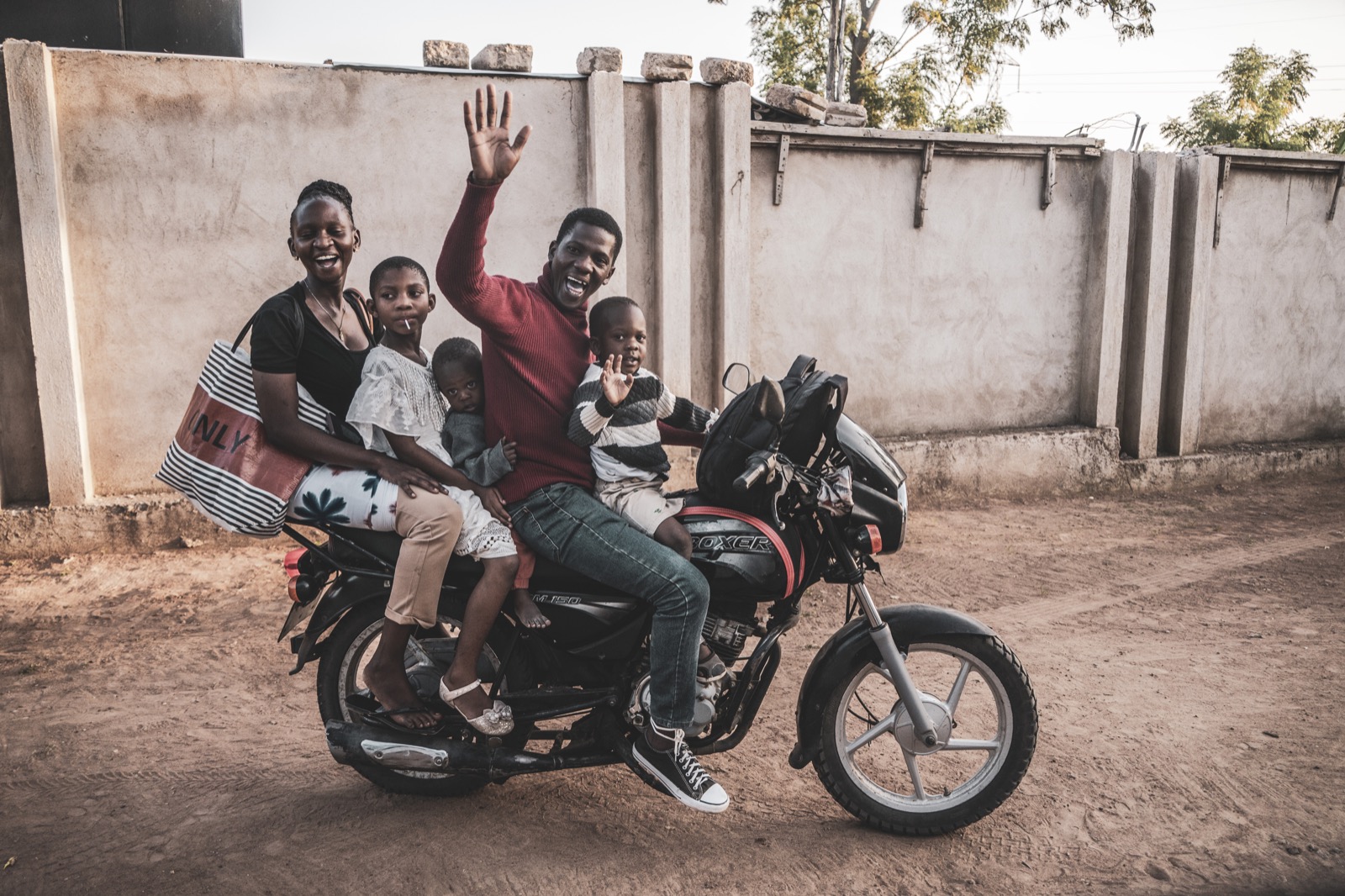 A family sitting together on a motorcycle